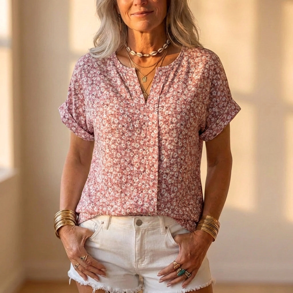 Blusa de algodón con estampado floral de rosas empolvadas y cuello de pico