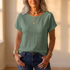 T-shirt in cotone con occhielli e motivo ritagliato all-over