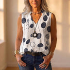 Camiseta sin mangas blanca con estampado floral rojo y gris