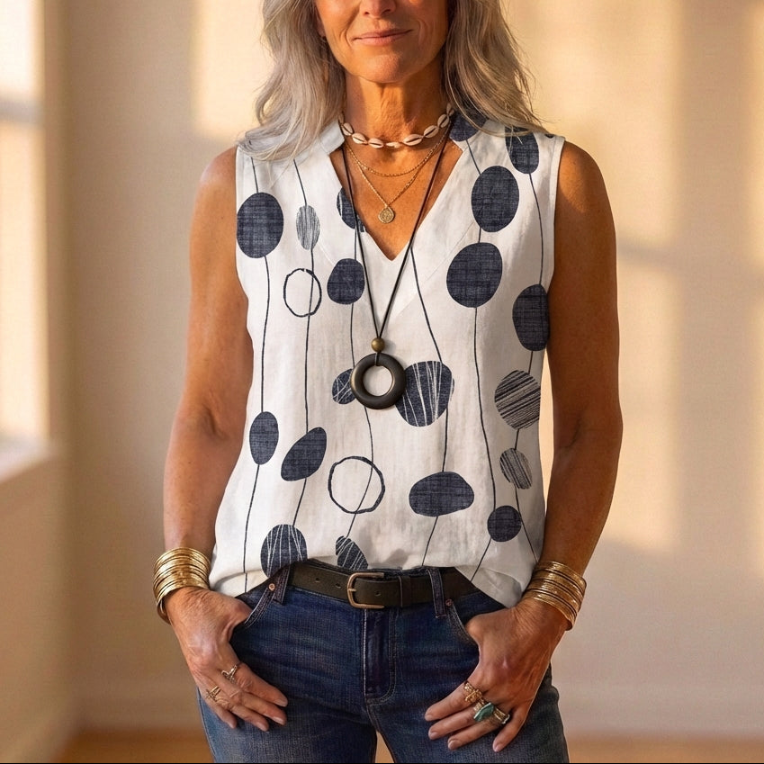 Camiseta sin mangas blanca con estampado floral rojo y gris